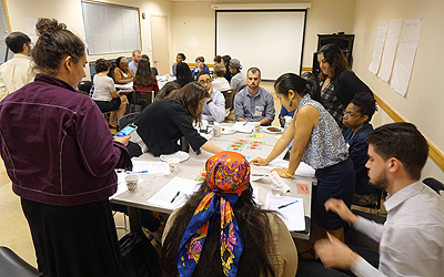 Stakeholder Roundtable people gathered around table talking